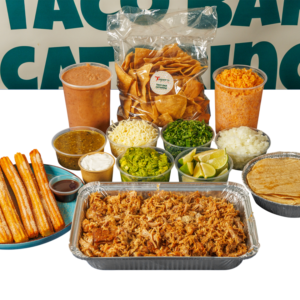 Mexican catering spread with carnitas, tortillas, chips, rice, beans, salsa, guacamole, cilantro, limes, and churros.